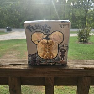 Flying Bear Toy with Gold and Purple Accents